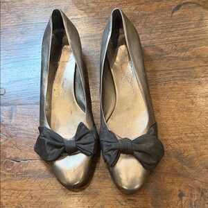Salvatore Ferragamo Metallic Flats with Brown Bow